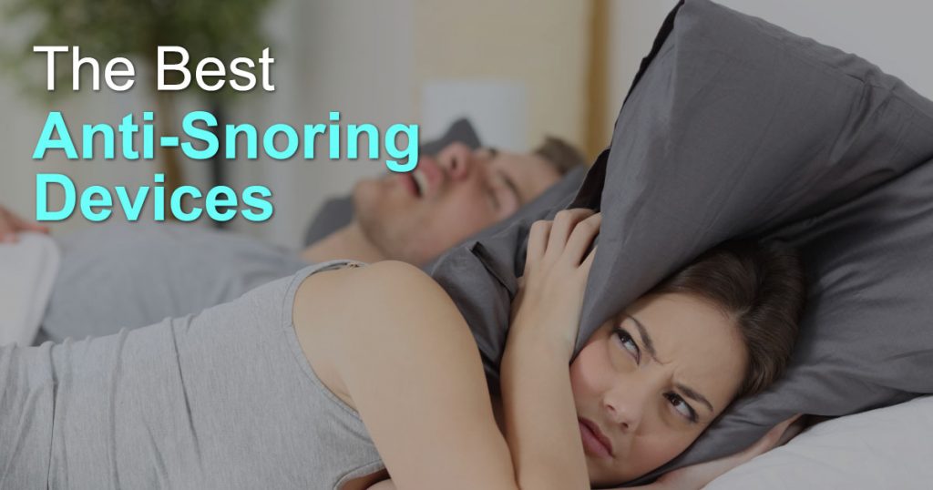 woman covering ears with pillow to drown out partner's snoring
