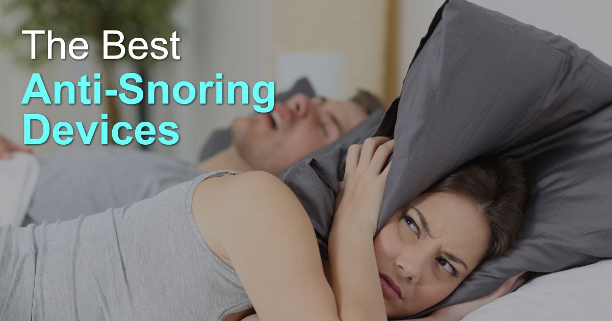 woman covering ears with pillow to drown out partner's snoring