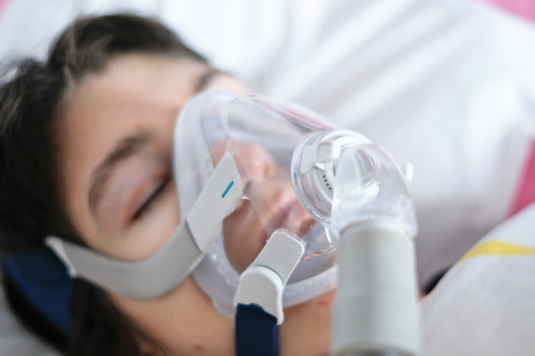 woman sleeping with cpap