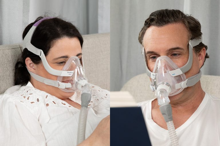 Man and Woman wearing AirFit F20 mask while awake and reading