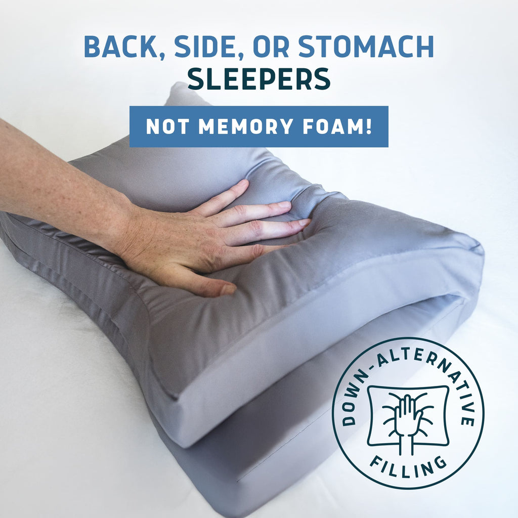 Lunderg travel CPAP pillow in grey being pressed by a hand to show down-alternative filling softness.