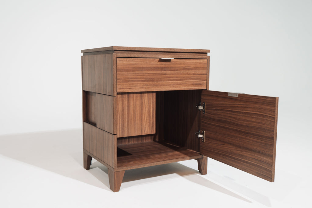 A Soho Walnut CPAP nightstand with the lower cabinet door open, revealing an empty storage compartment. The design includes a top drawer, a side cutout for hose access, and soft-close hinges for smooth operation.
