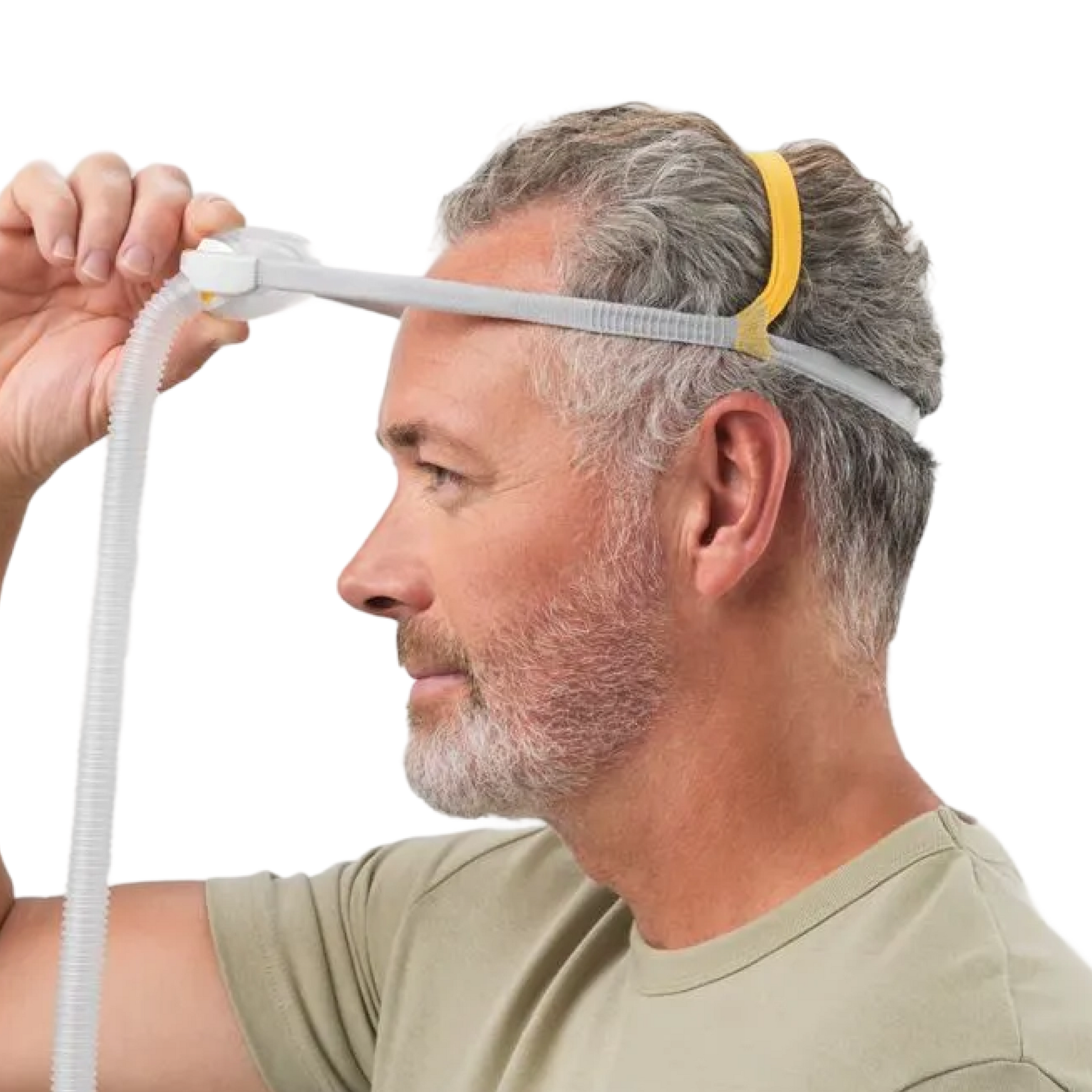 Image showing a man taking of his mask by holding the mask cushion and lifting it up.