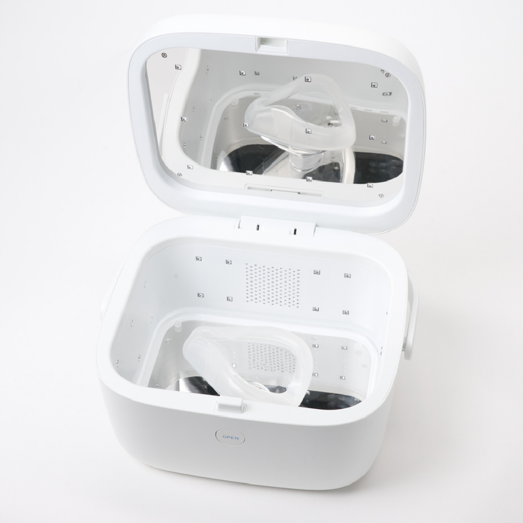 LiViliti Paptizer 360 white microbial reduction device open with a CPAP mask inside.