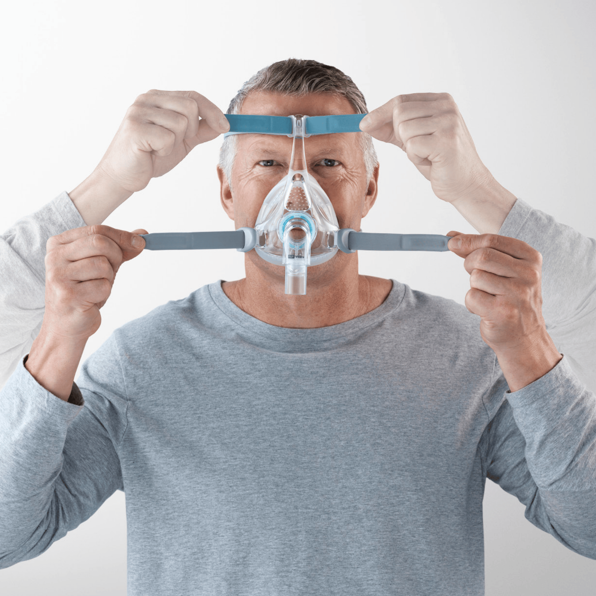 man wearing f&p vitera shows adjustment points