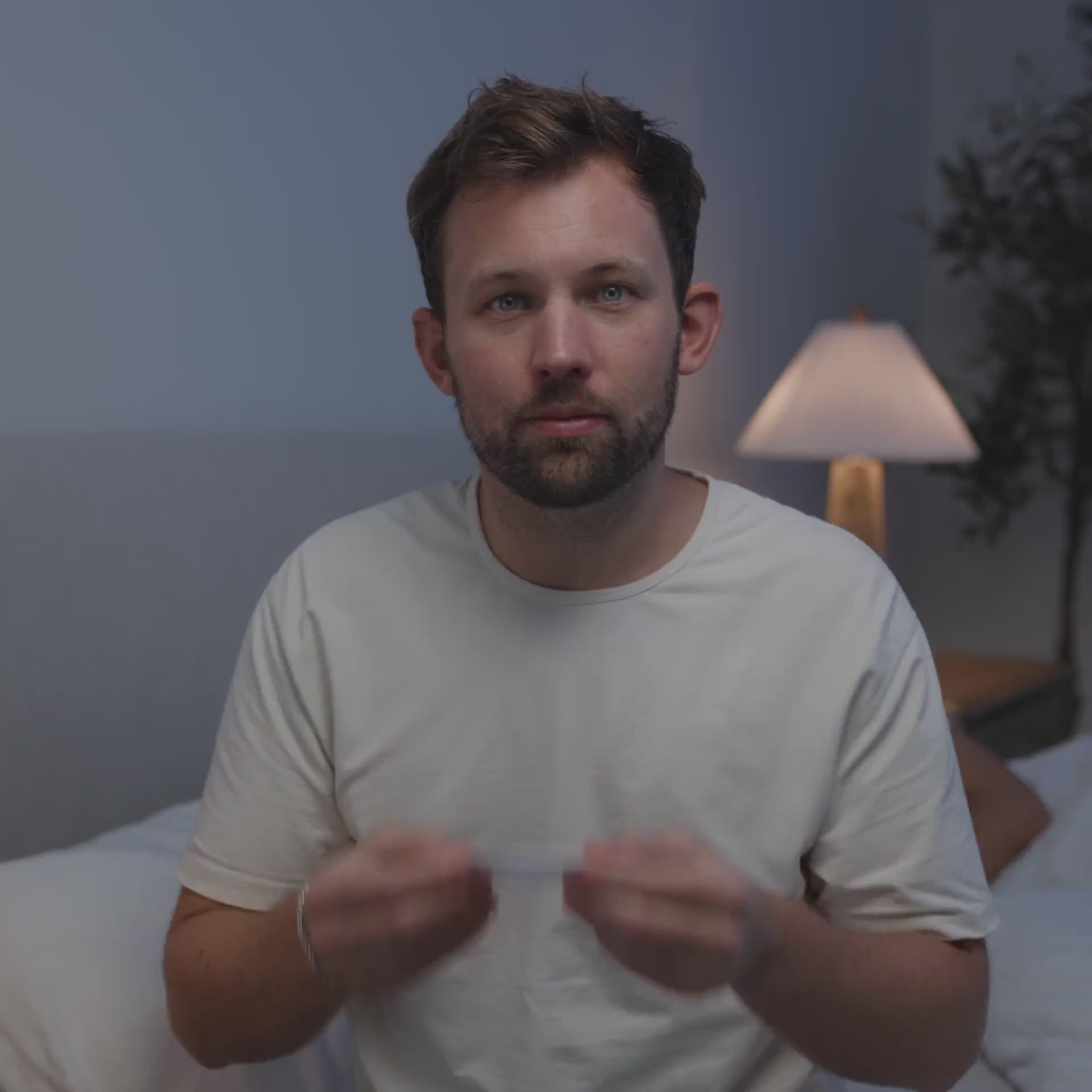 video showing a man applying intake mouth tape before putting on his AirFit P10 Nasal Pillow Mask and settling into bed, then falling asleep.