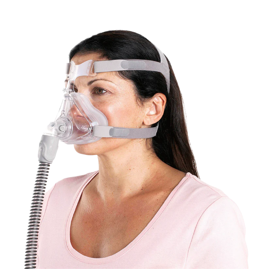 Image of a woman using a  Quattro™ Air Full Face Mask with Headgear For Her from a quarter angle