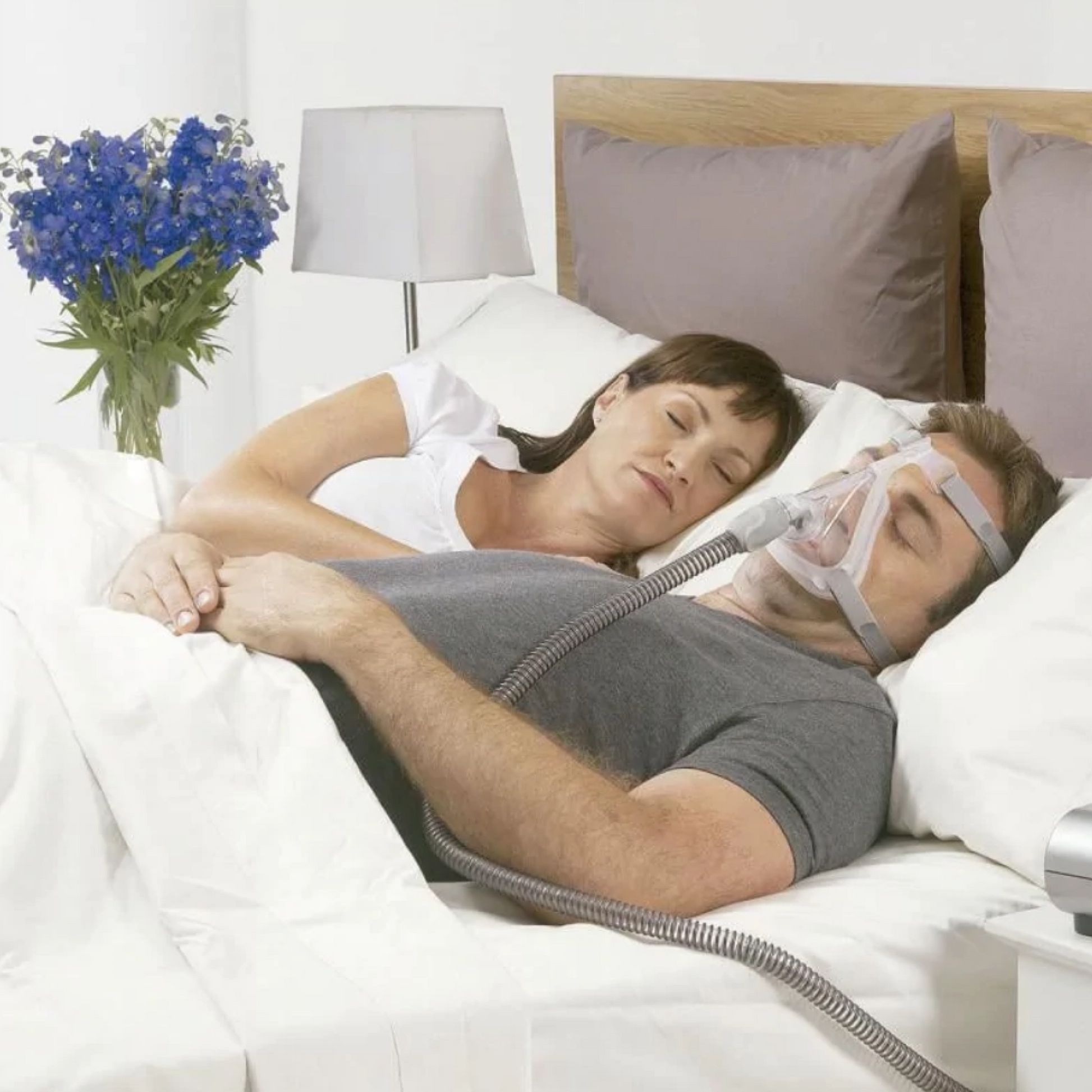 Image of a man peacefully sleeping while using a Quattro™ Air Full Face Mask with Headgear