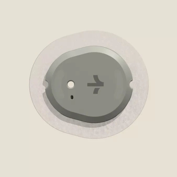 Grey CPAP machine sensor pad with a white adhesive backing.